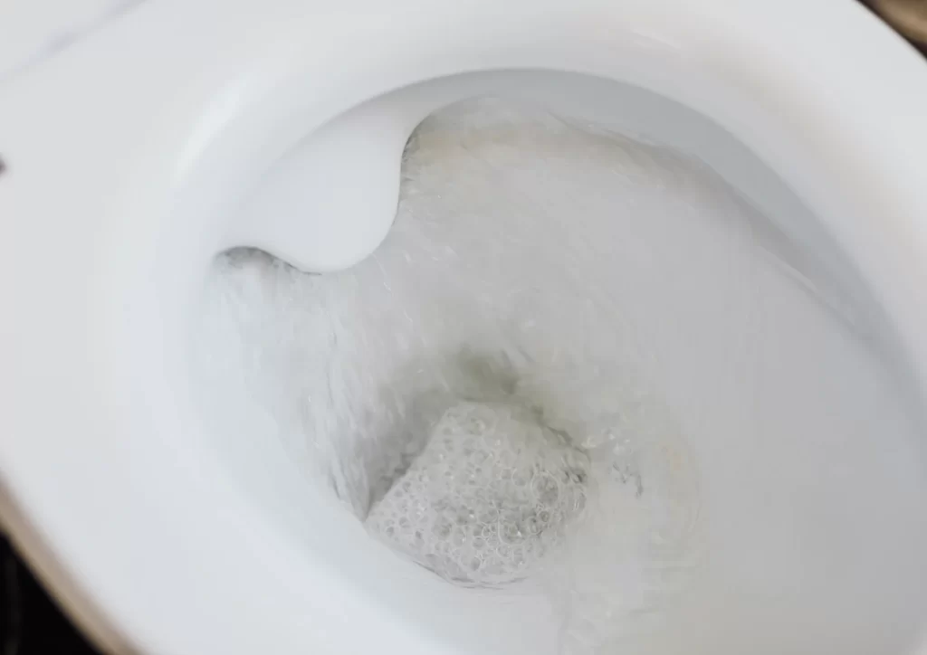 Close-up of a toilet running nonstop after flushing, expert plumbing repair by Springdale Plumbing