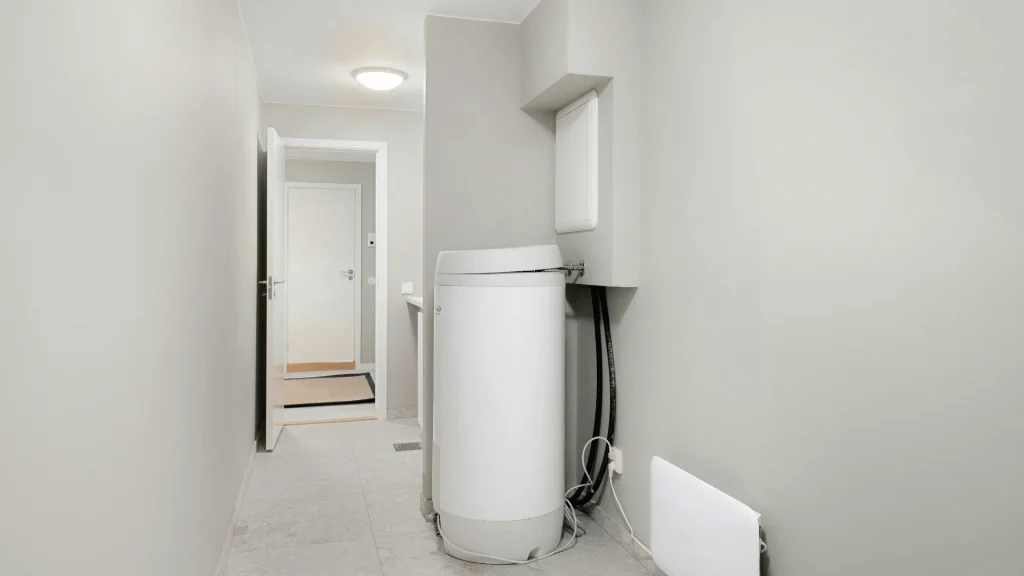 Hot Water Tank and Electric Heater in the Laundry Room